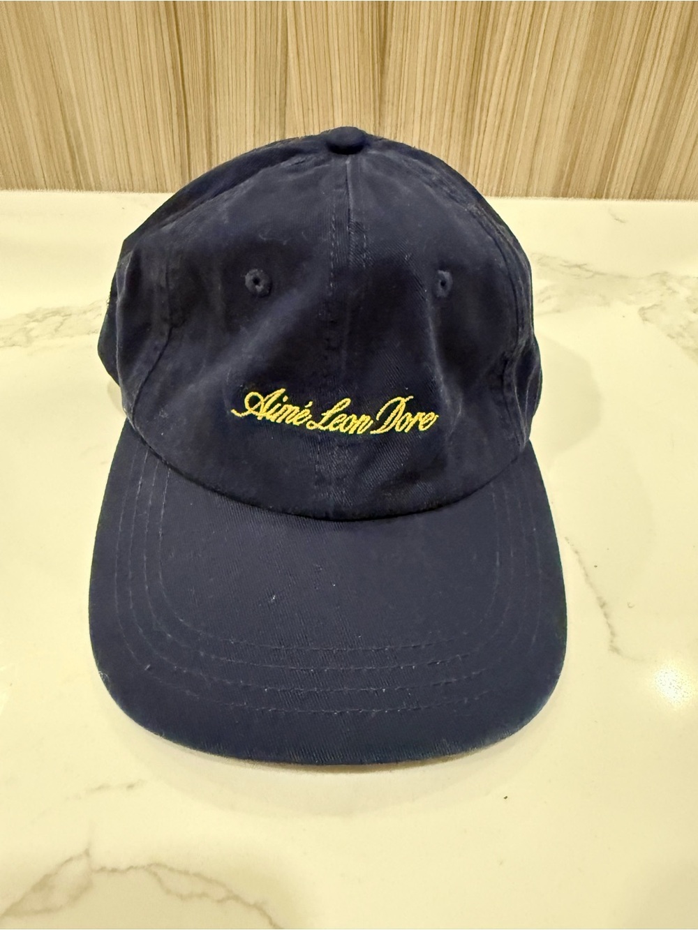 Aimé Leon Dore Washed Script Hat – Navy with Yellow Logo
